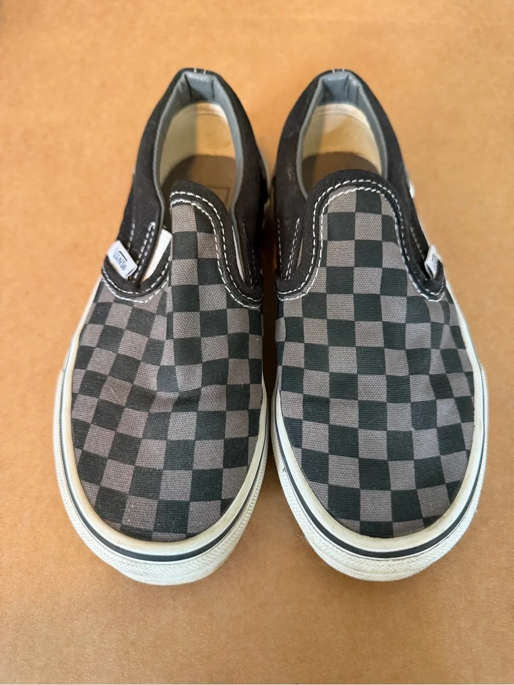Vans Kids Slip-On Sneakers in Black and Gray Checkerboard